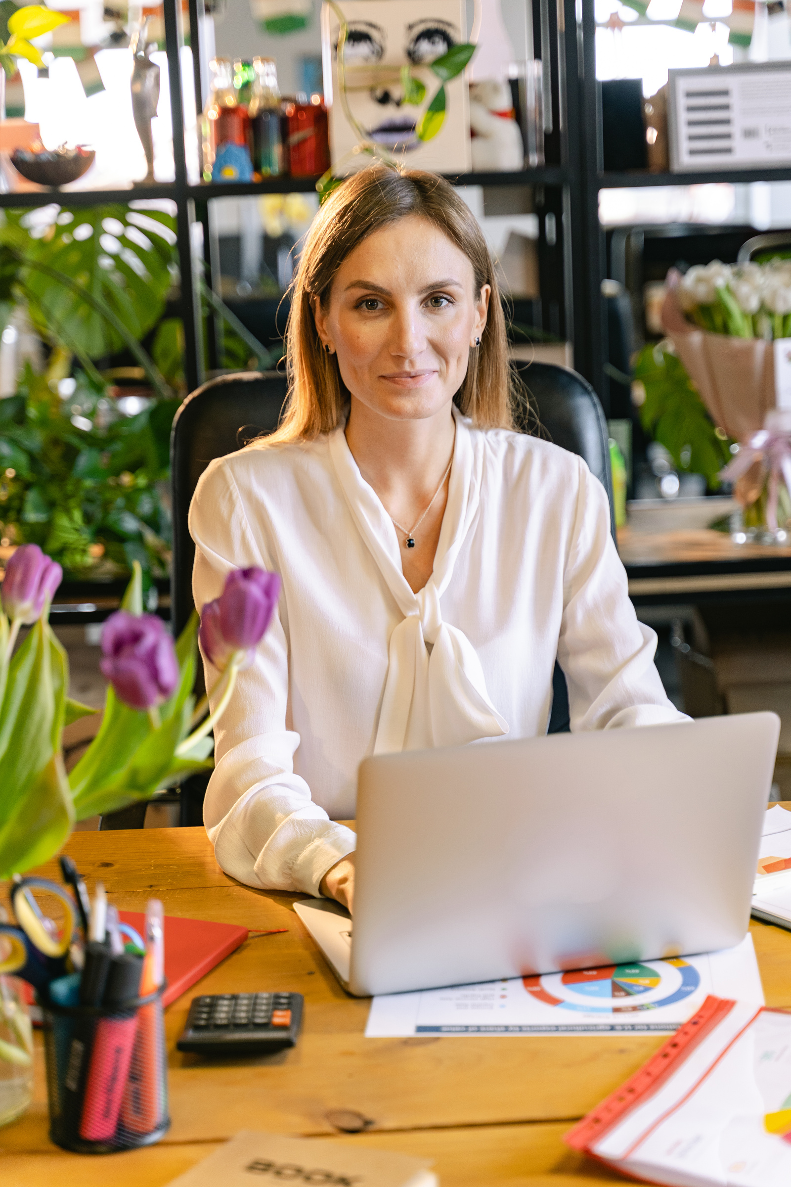 Portrait Shot of an Employee Using a Laptop